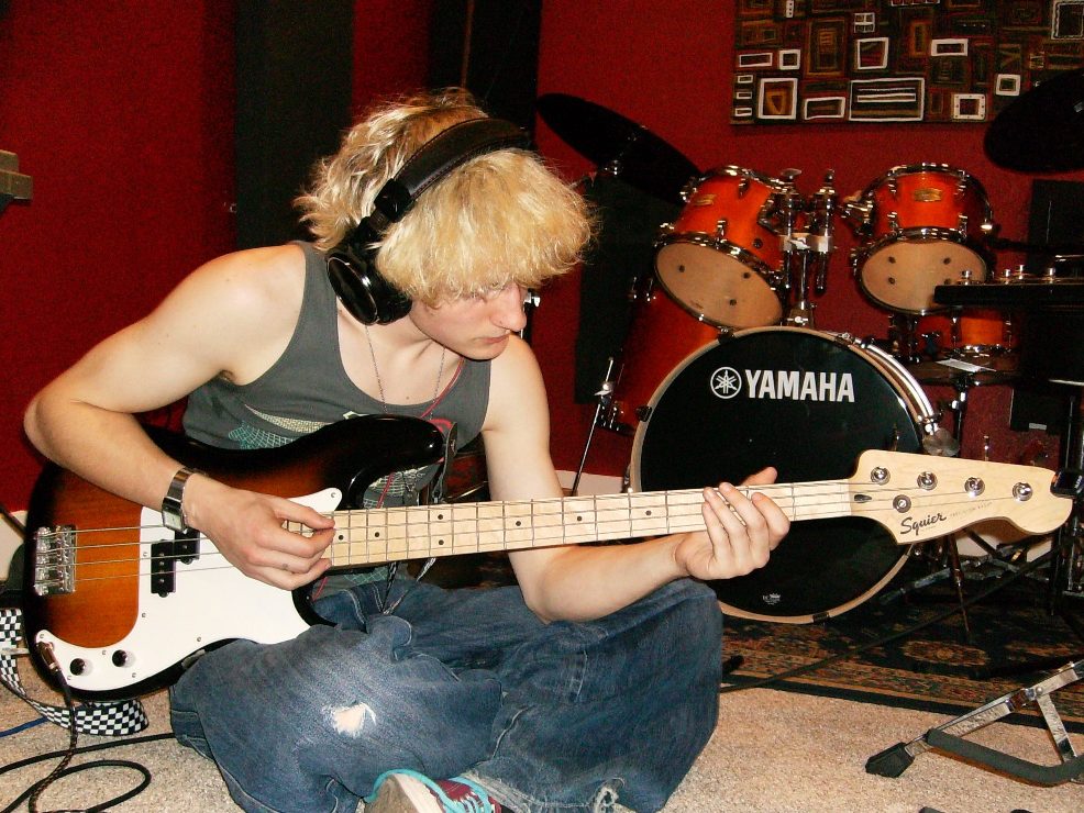 Recording bass in front of the Yamaha drum kit at Noisewatt